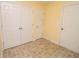 Hallway featuring linoleum flooring, neutral walls, a closet, and three interior doors at 22620 Lamong Rd, Sheridan, IN 46069