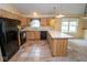 Well-lit kitchen with a breakfast bar area, efficient appliances, and ample cabinet space at 22620 Lamong Rd, Sheridan, IN 46069