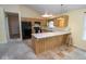 Efficient kitchen design with breakfast bar, ample counter space, and modern black appliances at 22620 Lamong Rd, Sheridan, IN 46069