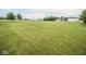 Vast, grassy property with mature trees and a serene atmosphere, offering endless possibilities for outdoor enjoyment at 22620 Lamong Rd, Sheridan, IN 46069