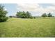 Expansive green yard with mature trees and well-maintained lawn, creating a beautiful and inviting outdoor setting at 22620 Lamong Rd, Sheridan, IN 46069
