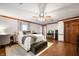 Bedroom with hardwood floors, a ceiling fan, and a king sized bed at 2708 N 400 E, Greenfield, IN 46140