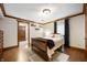 A cozy bedroom featuring a wood bed frame and a window at 2708 N 400 E, Greenfield, IN 46140