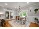 Charming dining area featuring modern chandelier and a beautiful view of the backyard at 2708 N 400 E, Greenfield, IN 46140
