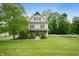 Charming two-story home with a large front yard and beautiful landscaping in a peaceful, wooded setting at 2708 N 400 E, Greenfield, IN 46140