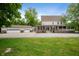 Charming two-story home featuring a brick facade, attached garage, and covered front porch at 2708 N 400 E, Greenfield, IN 46140