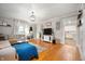 Bright living room featuring hardwood floors, decorative furnishings and an open entry to the kitchen at 2708 N 400 E, Greenfield, IN 46140