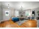 Bright living room with hardwood floors, a comfortable sectional sofa, and lots of natural light at 2708 N 400 E, Greenfield, IN 46140
