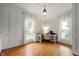 Bright home office space featuring hardwood floors, natural light, and modern decor at 2708 N 400 E, Greenfield, IN 46140