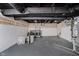 Unfinished basement with washer and dryer, painted floors, exposed ceiling and duct work at 2909 E Michigan St, Indianapolis, IN 46201