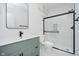 Modern bathroom with vanity, stylish mirror, sleek fixtures and glass-enclosed shower at 2909 E Michigan St, Indianapolis, IN 46201