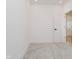 This bedroom has carpet flooring, white walls and trim and a modern white door at 2909 E Michigan St, Indianapolis, IN 46201