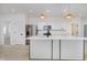 Modern kitchen featuring a spacious center island, stainless steel appliances, and sleek white cabinetry at 2909 E Michigan St, Indianapolis, IN 46201
