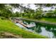 Aerial shot of a canal with a pontoon boat docked in front of a home at 2949 River Bay N Dr, Indianapolis, IN 46240