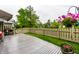 Back yard features wood deck, privacy fence and lawn with flower features and beautiful view at 2949 River Bay N Dr, Indianapolis, IN 46240