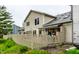 View of a backyard with a weathered deck and a charming fence creating an outdoor living area at 2949 River Bay N Dr, Indianapolis, IN 46240