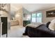 Bedroom with a serene view of the en-suite bathroom, complete with natural light and storage at 2949 River Bay N Dr, Indianapolis, IN 46240