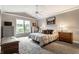 A comfortable bedroom with a large window, neutral tones, and ample storage at 2949 River Bay N Dr, Indianapolis, IN 46240
