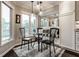 Sunlit breakfast nook with built-in seating and modern lighting in kitchen at 2949 River Bay N Dr, Indianapolis, IN 46240