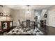 Formal dining room with hardwood floors, modern decor, and elegant chandelier at 2949 River Bay N Dr, Indianapolis, IN 46240