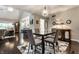 Open concept with formal dining room featuring hardwood floors, and modern decor at 2949 River Bay N Dr, Indianapolis, IN 46240