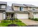 Charming townhouse with beautiful landscaping, two-car garage, and lovely curb appeal at 2949 River Bay N Dr, Indianapolis, IN 46240