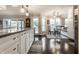 Kitchen island with granite countertops and breakfast nook with hardwood floors at 2949 River Bay N Dr, Indianapolis, IN 46240