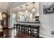 Eat-in kitchen with bar seating, pendant lighting, and a view to the backyard at 2949 River Bay N Dr, Indianapolis, IN 46240