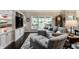 Comfortable living room boasting custom built-ins, a fireplace, and a serene view at 2949 River Bay N Dr, Indianapolis, IN 46240