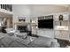 Bright living room with fireplace, built-in shelving, hardwood floors, and comfortable seating at 2949 River Bay N Dr, Indianapolis, IN 46240