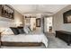 Bright main bedroom boasts decor accents, natural light and ensuite bath with stone counters and modern lighting at 2949 River Bay N Dr, Indianapolis, IN 46240
