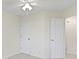 This bedroom has neutral walls and carpet and two access doors at 3014 Saddlehorn Dr, Carmel, IN 46033