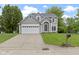 Charming two-story home features a well-manicured lawn and attached two-car garage at 3014 Saddlehorn Dr, Carmel, IN 46033