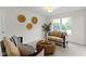 Inviting living room features comfortable seating and a large window with backyard views at 3014 Saddlehorn Dr, Carmel, IN 46033