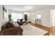 Inviting living room featuring comfortable seating, stylish décor, and smooth hardwood flooring at 3014 Saddlehorn Dr, Carmel, IN 46033