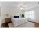 Serene main bedroom with white linens, a ceiling fan, and natural light from the window at 3014 Saddlehorn Dr, Carmel, IN 46033
