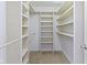 Spacious walk-in closet with custom shelving and organization system at 3014 Saddlehorn Dr, Carmel, IN 46033