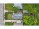 Aerial view of the property featuring a well-maintained house, garage and mature trees at 3334 N Chester Ave, Indianapolis, IN 46218