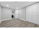 Spacious basement with wood-look vinyl floors and neutral paint color offers versatile living space at 3334 N Chester Ave, Indianapolis, IN 46218