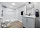 Modern bathroom featuring a walk-in shower and stylish vanity with contemporary fixtures at 3334 N Chester Ave, Indianapolis, IN 46218