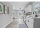 Bright kitchen featuring white cabinets, stainless appliances, and modern fixtures at 3334 N Chester Ave, Indianapolis, IN 46218