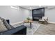 Modern living room with a sleek fireplace, TV, stylish furniture, and a cozy rug at 3334 N Chester Ave, Indianapolis, IN 46218