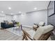 Basement living room with modern furniture, recessed lighting, and a decorative rug at 3334 N Chester Ave, Indianapolis, IN 46218