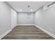 Spacious room with modern flooring, neutral paint, and ample natural light from the window at 3334 N Chester Ave, Indianapolis, IN 46218