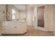 A bathroom features a shower, a vanity, and patterned wallpaper at 3585 Bay Rd N Dr, Indianapolis, IN 46240