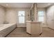 A bathroom includes a vanity, lots of lighting, and a soaking tub at 3585 Bay Rd N Dr, Indianapolis, IN 46240