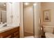 Simple bathroom with vanity, toilet, and glass-enclosed shower at 3585 Bay Rd N Dr, Indianapolis, IN 46240