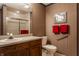 Well-maintained bathroom with vanity, toilet, and shower with glass doors at 3585 Bay Rd N Dr, Indianapolis, IN 46240