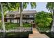 Waterfront home featuring a dock, and a two-level deck overlooking the lake at 3585 Bay Rd N Dr, Indianapolis, IN 46240