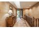 Elegant foyer with tiled floor, wooden accents, and a view of the front yard through a glass door at 3585 Bay Rd N Dr, Indianapolis, IN 46240